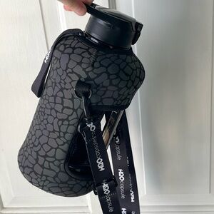 H2O Capsule 2.2L Half Gallon Water Bottle Storage Sleeve Covered Straw Cheetah